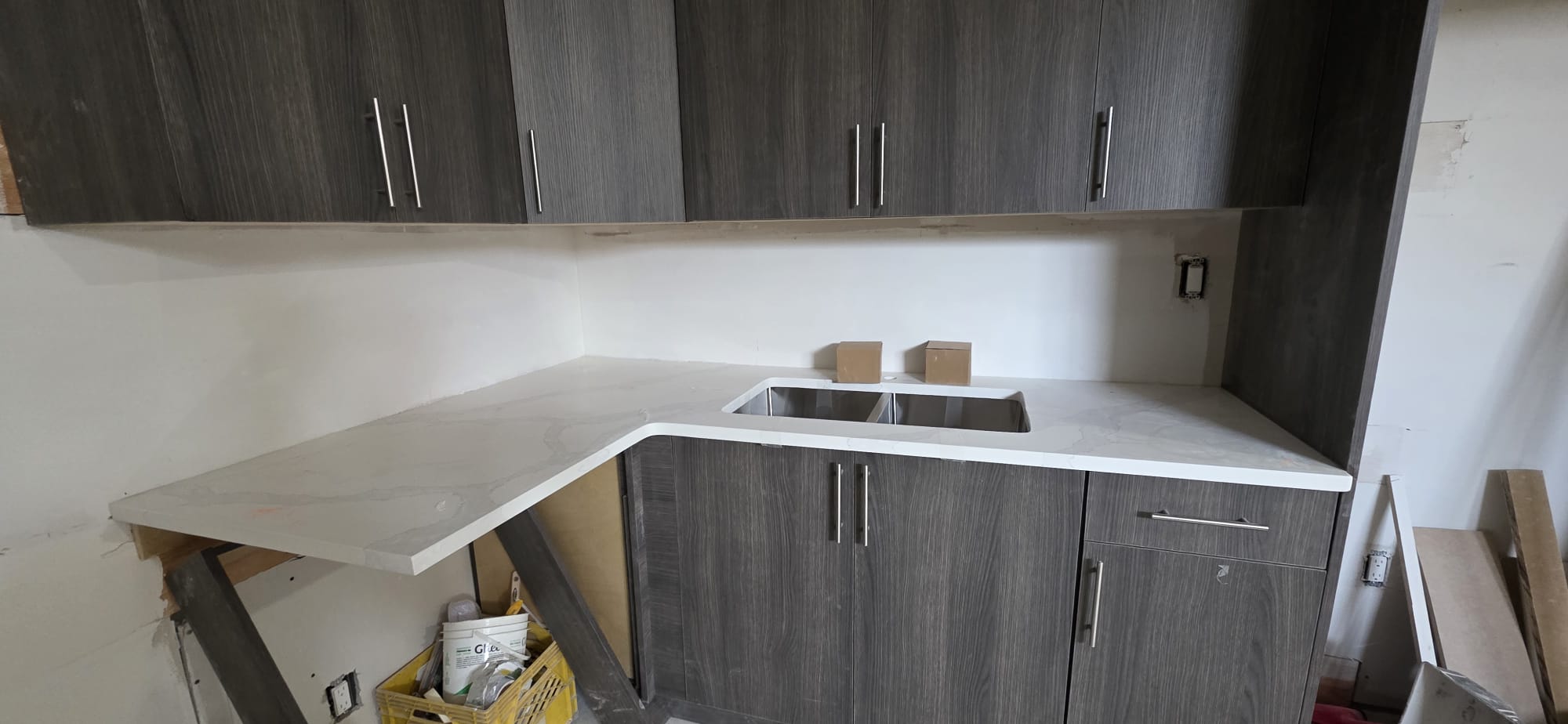 White calacatta quartz on dark wood cabinets, Calgary