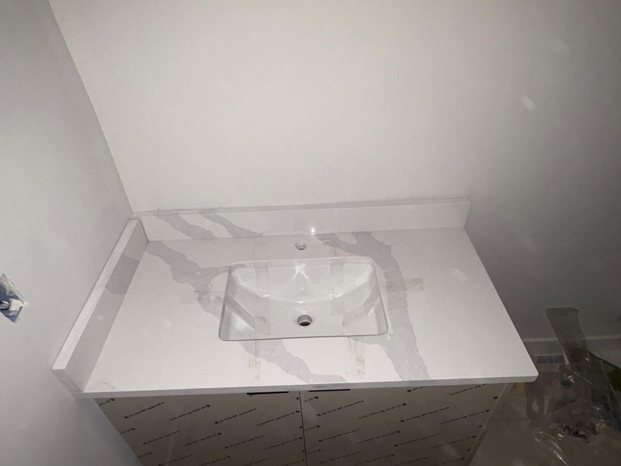 Vanity top with bold grey veining, Calgary install by Bedrock Countertops