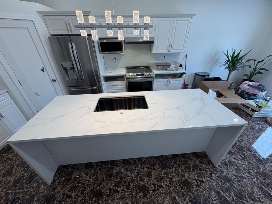 Veined white quartz island with sink, Calgary install by Bedrock Countertops