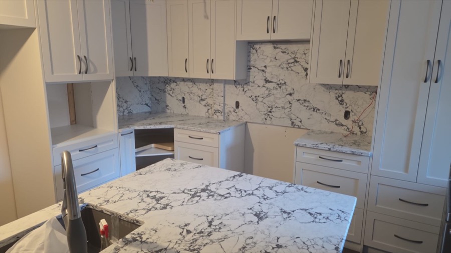Quartz island and full-height backsplash, Calgary install by Bedrock Countertops