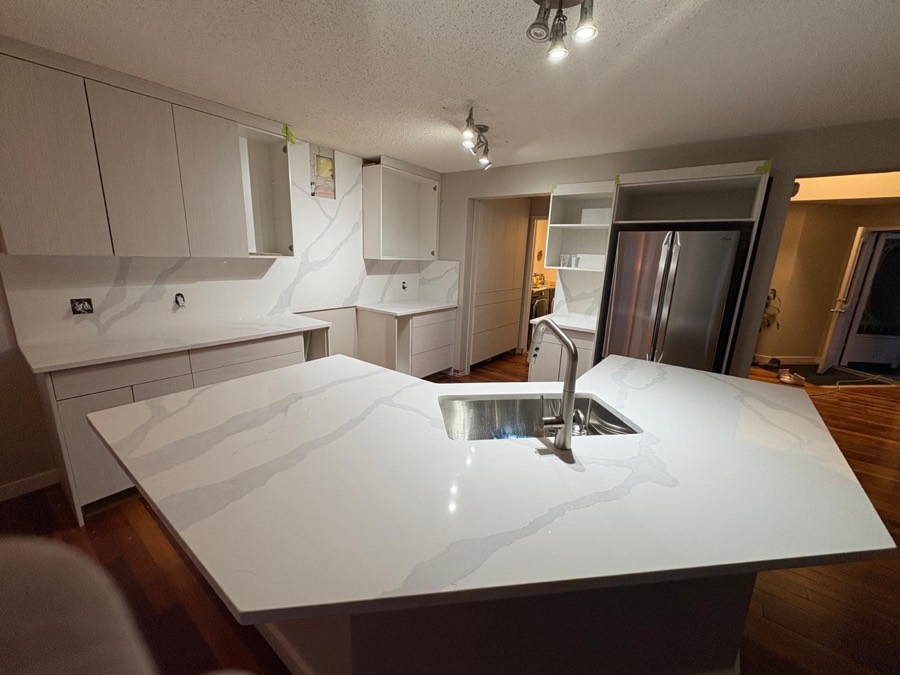 White quartz island with undermount sink, Calgary install by Bedrock Countertops