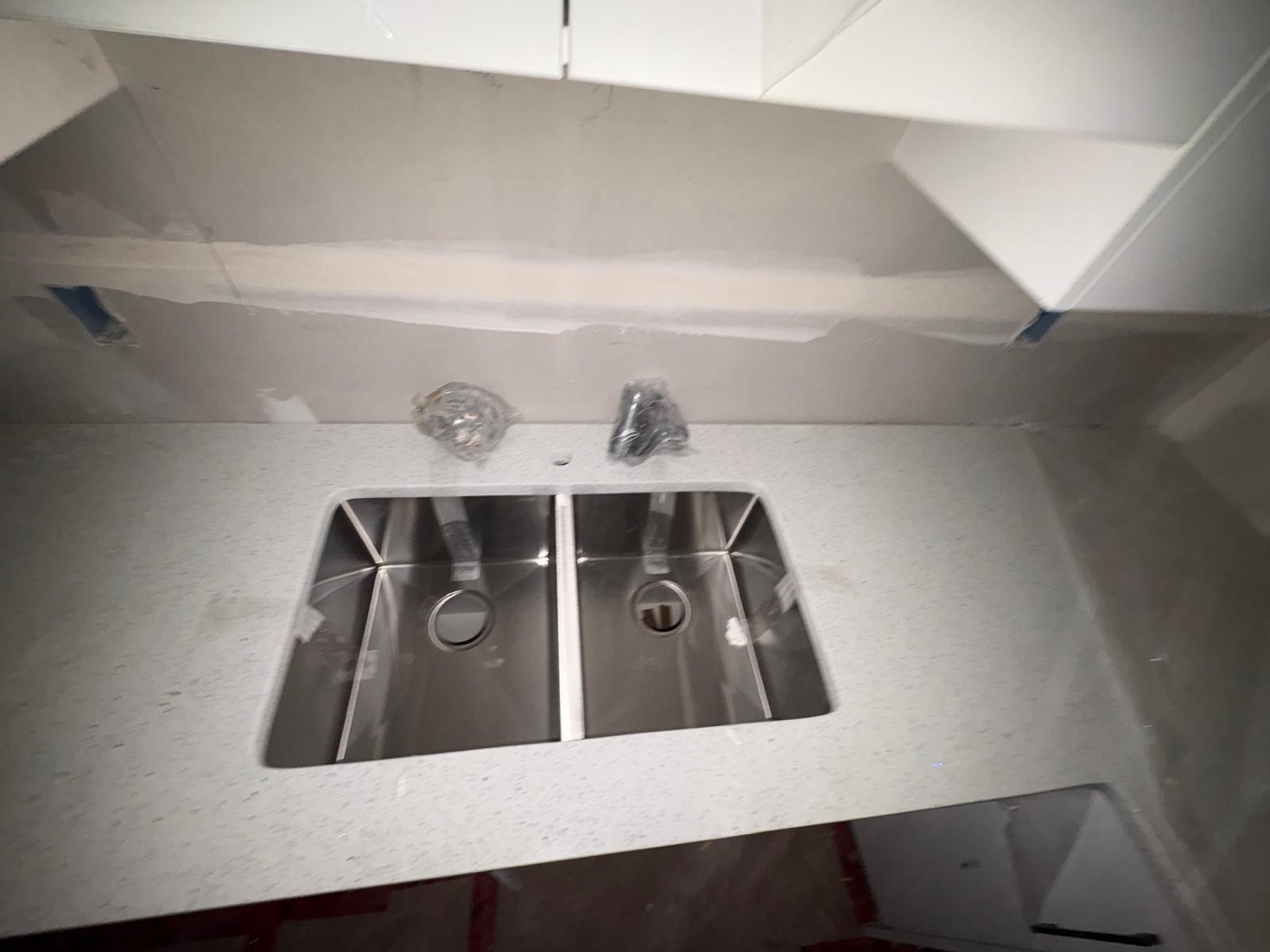 Precision undermount double sink cutout in a quartz countertop, Calgary